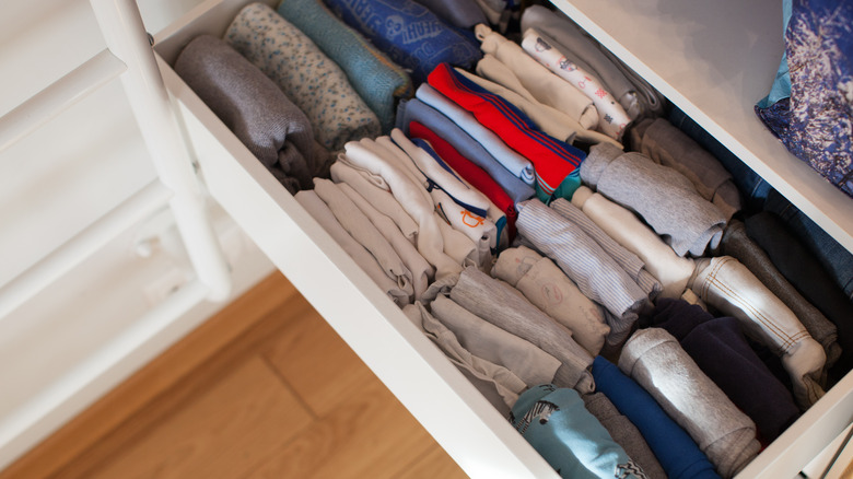 folded clothes in dresser