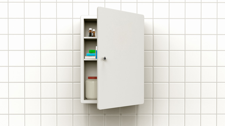 a partially open medicine cabinet