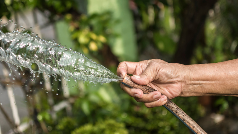 blocking a hose with finger