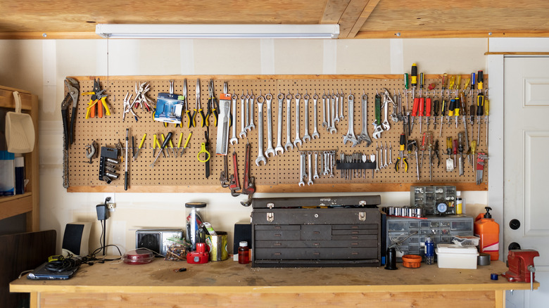 A workshop table filled with tools