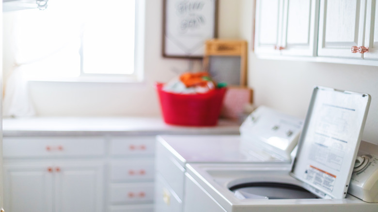 spacious laundry room with windows