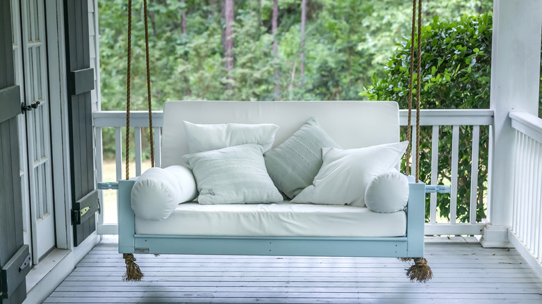 Swinging bench on porch