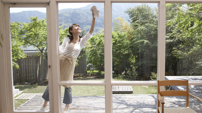 Woman cleaning windows