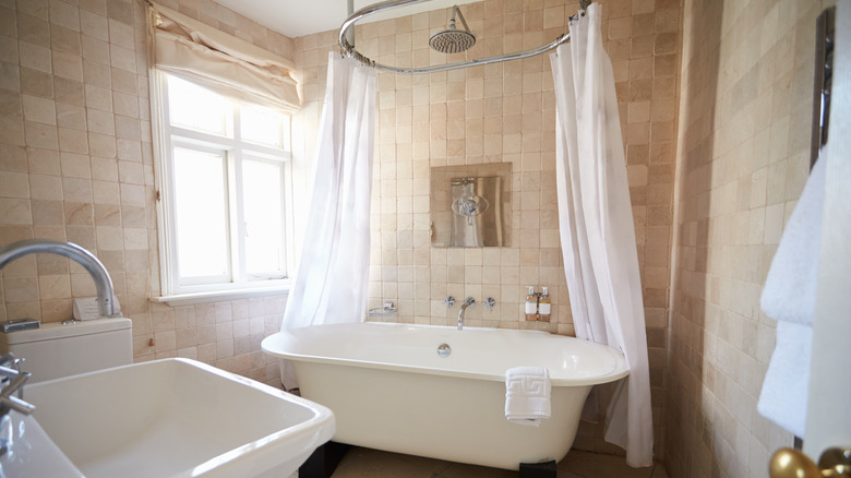 White shower curtain in bathroom