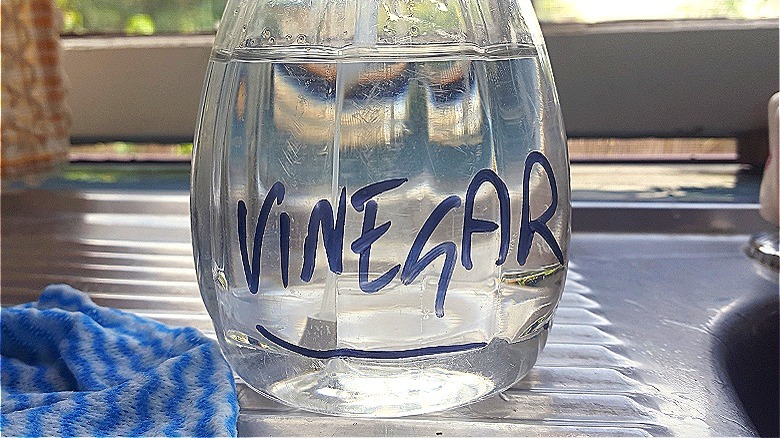 Clear bottle marked "vinegar"