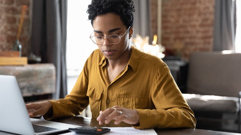 woman calculating payments