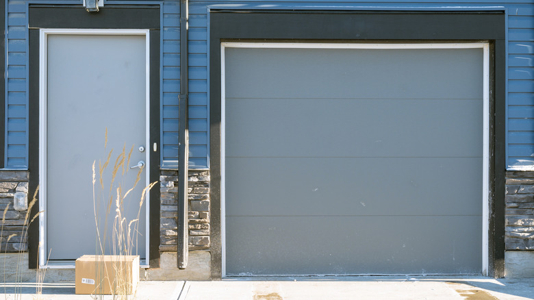 A modern front door and garage.