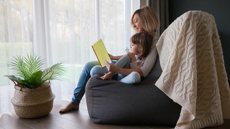 Woman and child on bean bag chair