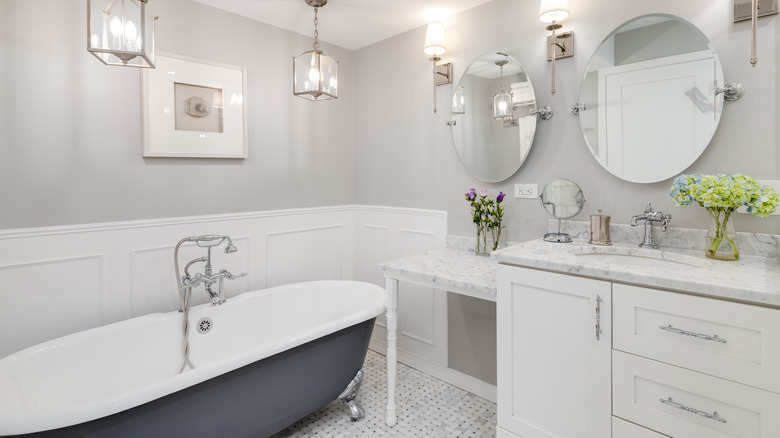 White bathroom with clawfoot tub 