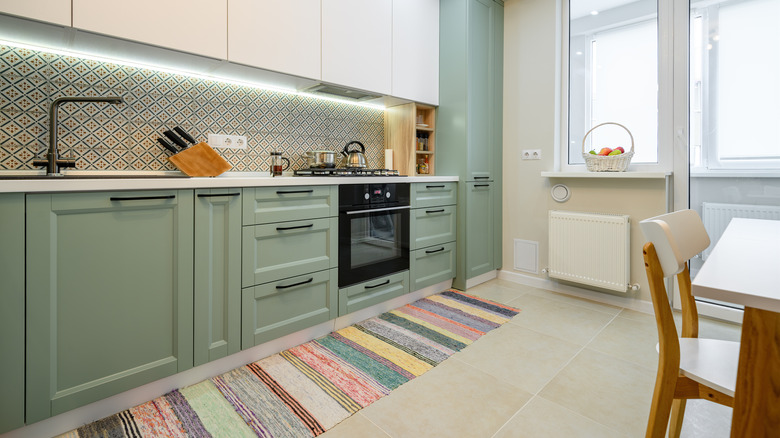 Green and white kitchen cabinets