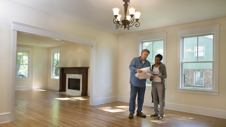 Homeowner and home inspector looking at paper