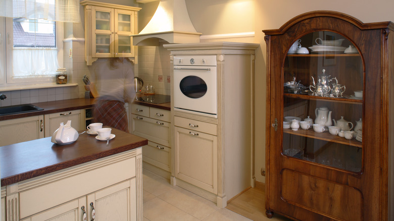 Brown curio cabinet in kitchen 