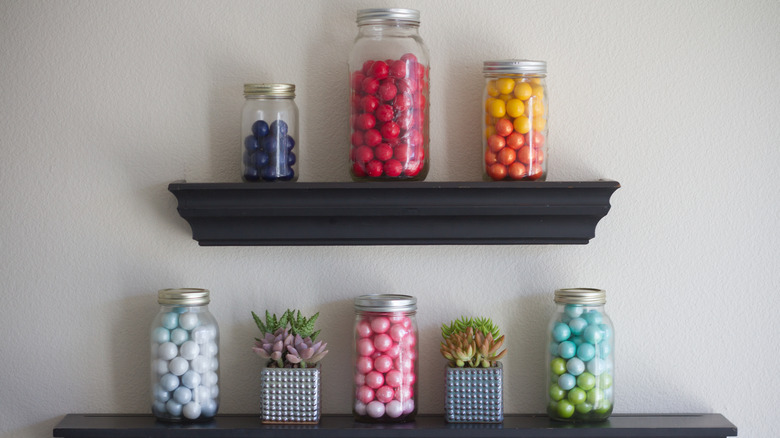 colorful balls in mason jars