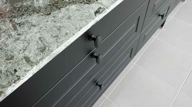 Granite countertop and black cabinets