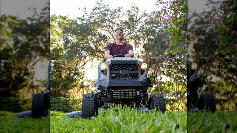 person riding Murray riding mower