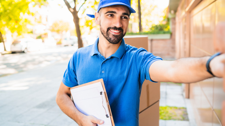 Man ringing doorbell