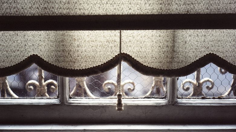 Scalloped curtain over a window