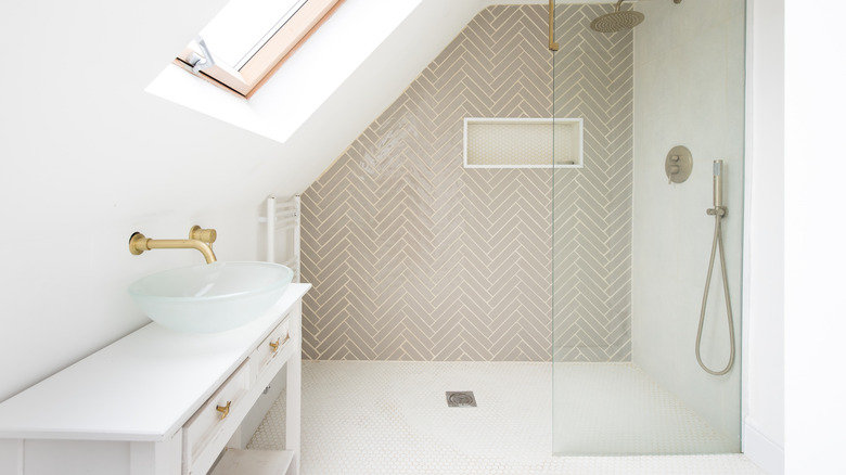 Beautiful white shower room with angled ceiling