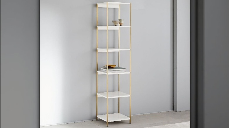 white and gold bookcase