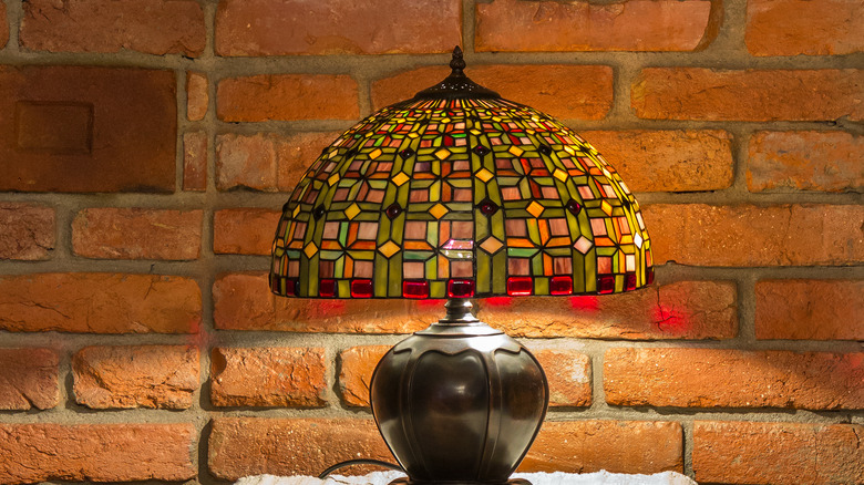 Tiffany lamp brick wall