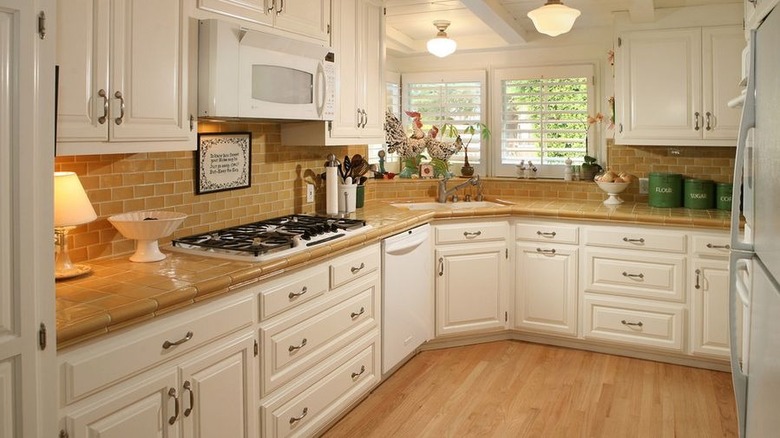 Kitchen with yellow tile countertops