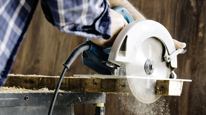 person using a table saw