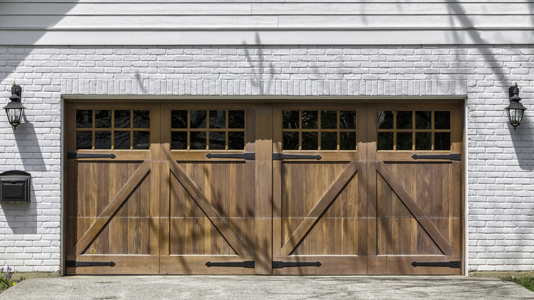Wood garage door with decorative elements