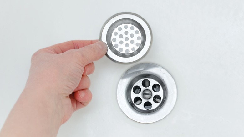 https://www.housedigest.com/img/gallery/are-you-cleaning-your-shower-drain-often-enough/intro-1694023449.jpg