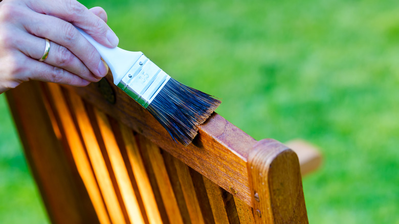 paint brush on wooden chair