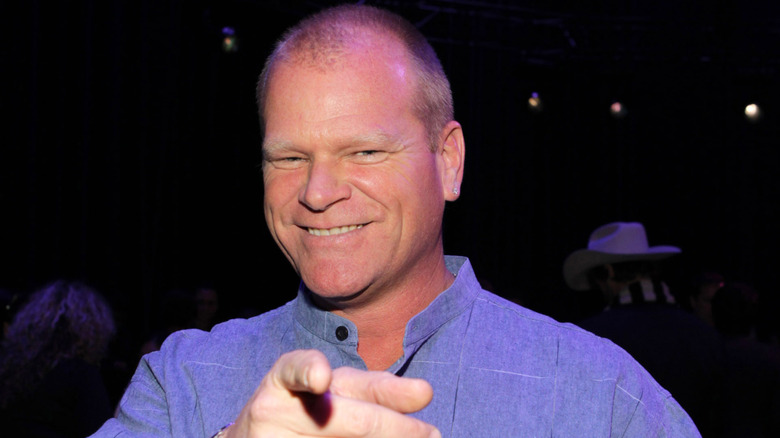 Mike Holmes smiling and pointing at camera