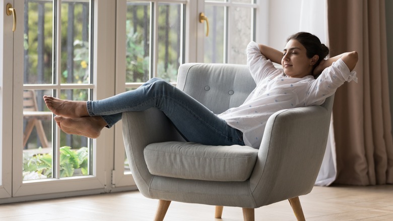 woman relaxing in armchair