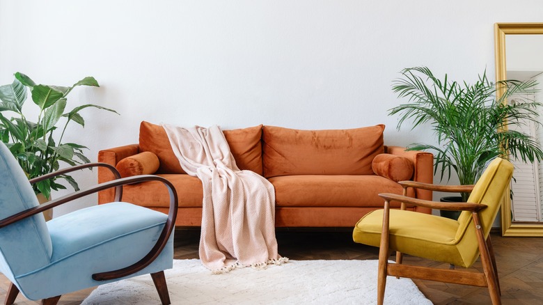 two styles of armchairs with couch