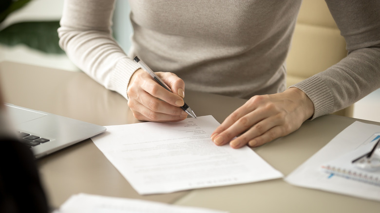 woman signing contract