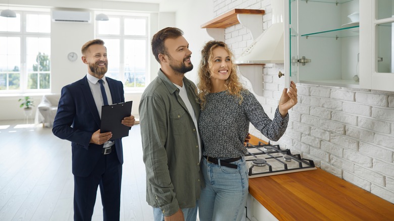 couple examining finished kitchen