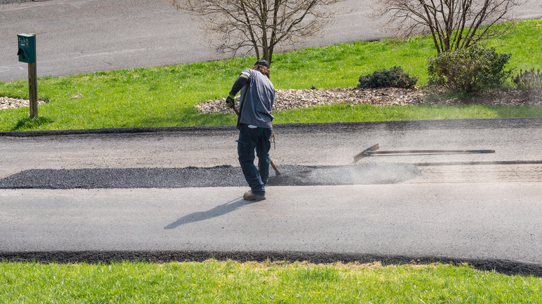 Applying blacktop to street