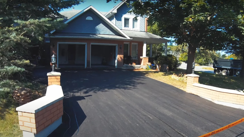 Home with asphalt driveway