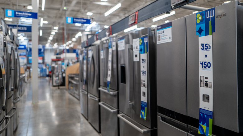 A row of refrigerators for sale