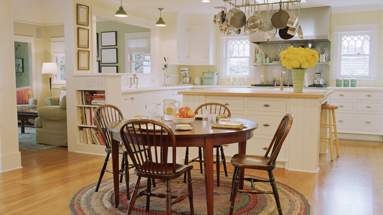 A kitchen with wood floors and warm-color decor