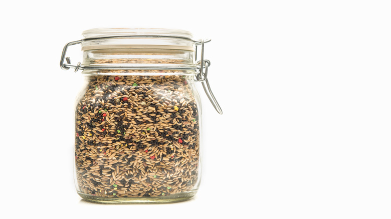 Glass container full of seed