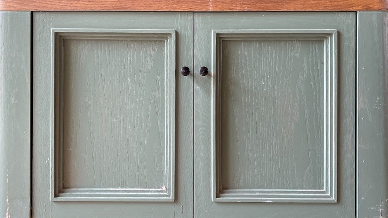 Wood cabinets painted green