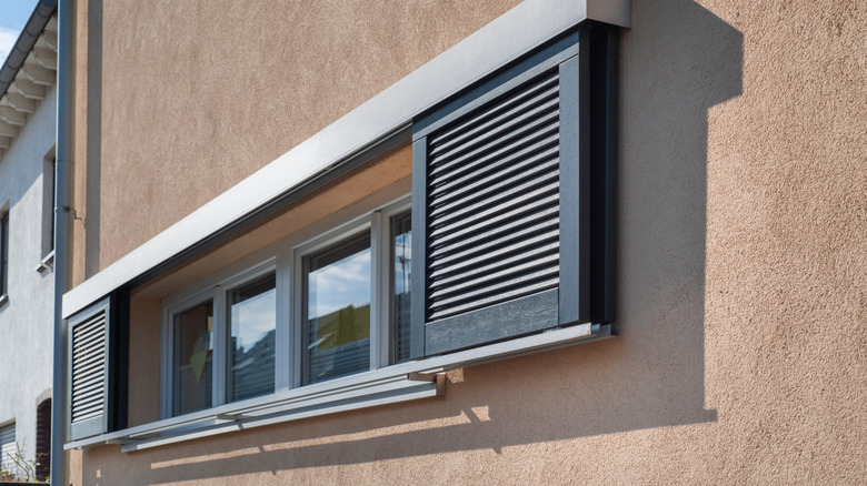 Sliding window shutters on the exterior of a building