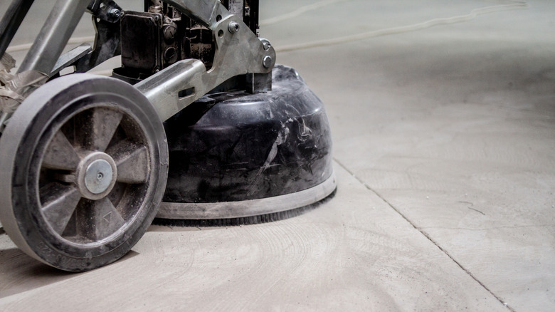 A machine grinds down concrete floors