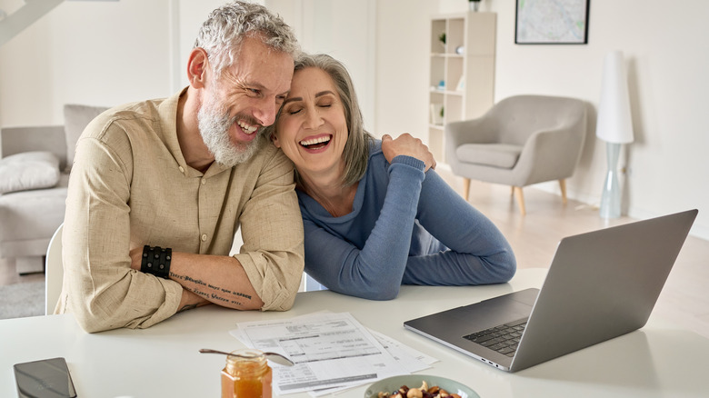 Older couple using laptop