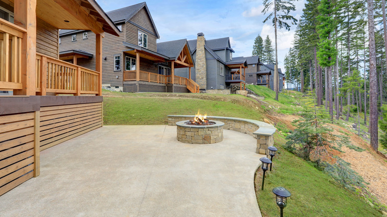 Large backyard patio with firepit