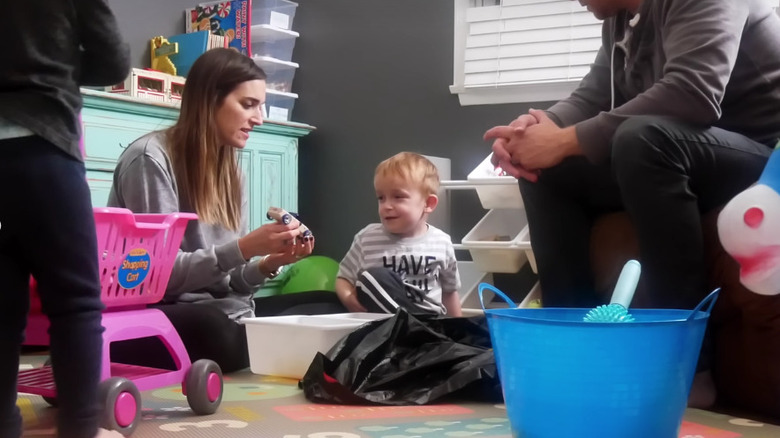 parent cleaning toys with kid