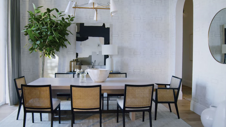 A large indoor tree in a dining room