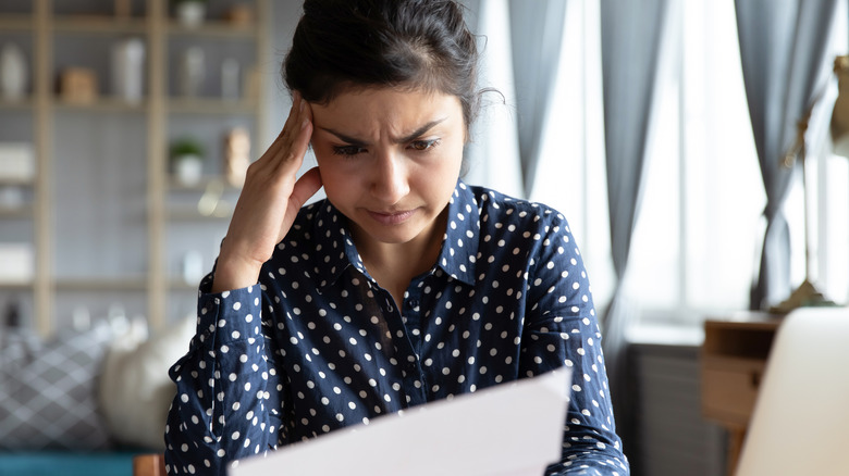 woman upset at paper bill