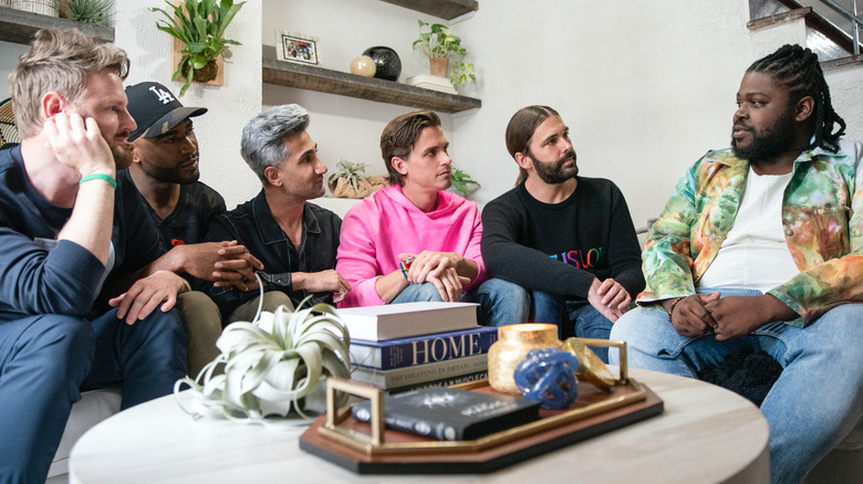 Queer eye cast sitting on couch