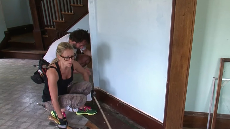 Nicole Curtis restoring a baseboard