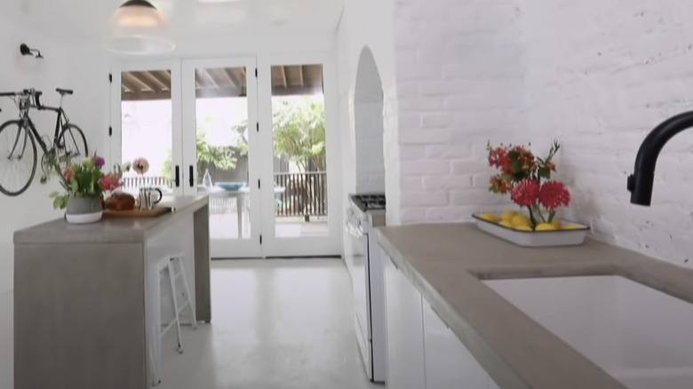 concrete kitchen with white walls